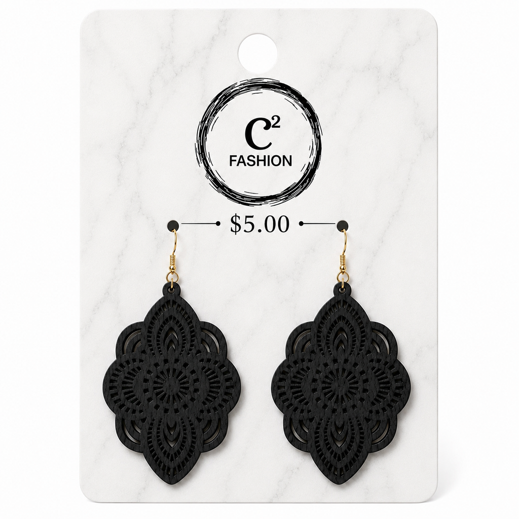 A pair of black lace-up dangle earrings displayed on a white marble-style retail card. The card shows the C2 FASHION logo, a price of $5.