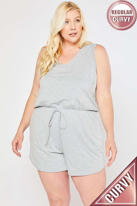 Woman wearing a gray sleeveless top and shorts set on a white background with 'Curvy' branding.