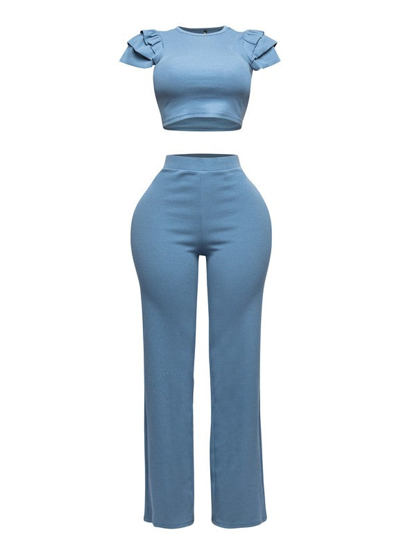 Blue two-piece outfit with a top and pants on a white background