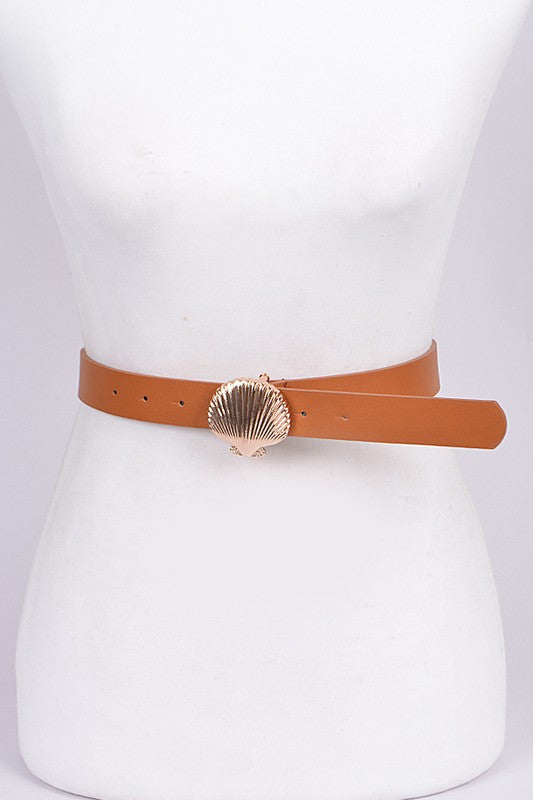 Tan belt with a shell buckle on a mannequin against a white background
