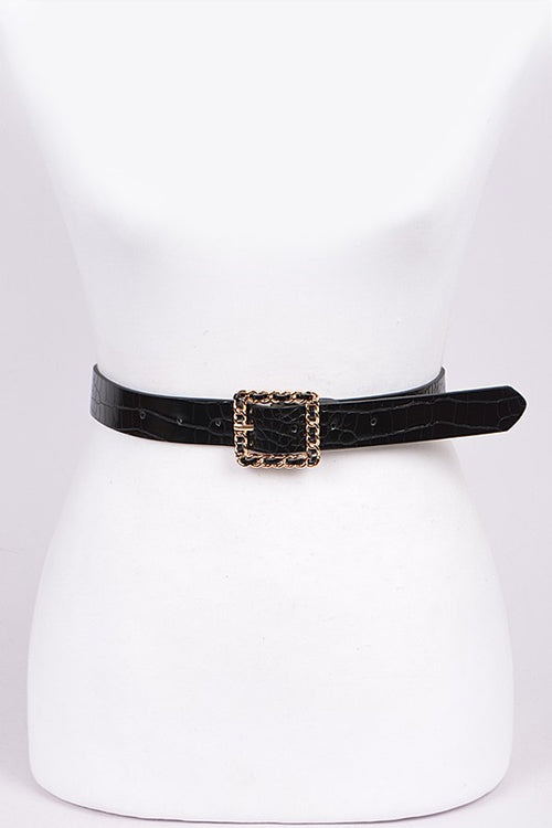 Black belt with a gold buckle on a white mannequin.