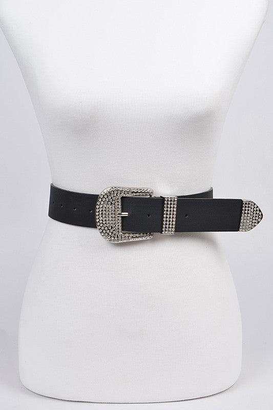 Black belt with a decorative silver buckle on a mannequin against a white background