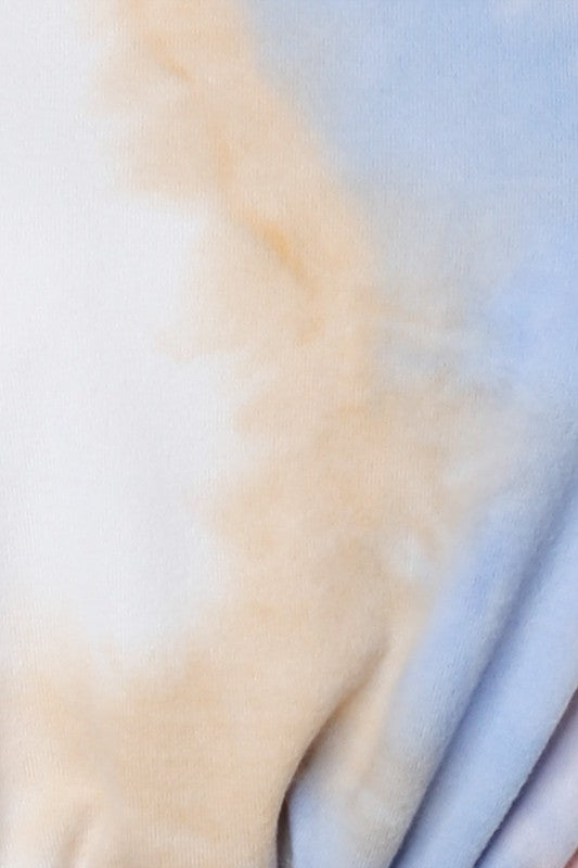 Close-up of fabric with a gradient of beige to blue.