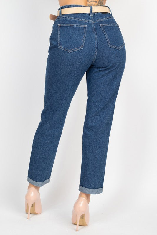 Blue jeans worn by a person on a white background