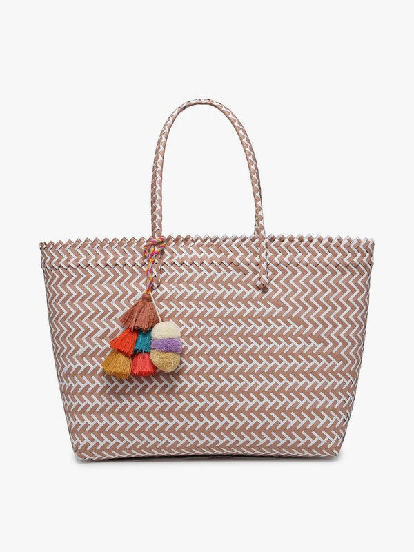 Woven tote bag with colorful tassel on a white background