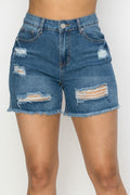 Denim shorts with distressed details on a white background