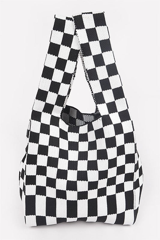 Black and white checkered bag on a light gray background