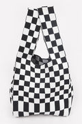 Black and white checkered bag on a light gray background