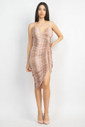 Woman wearing a patterned dress on a white background