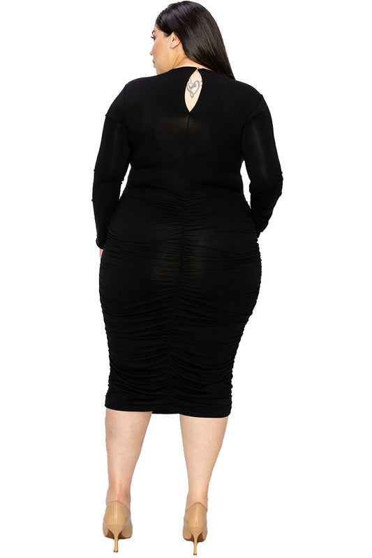 Black ruched dress worn by a model on a white background