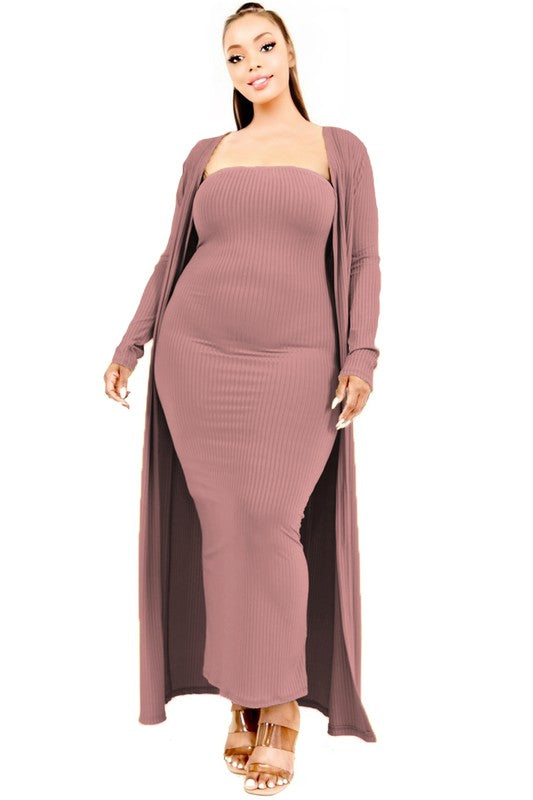 Woman wearing a mauve ribbed dress with a matching cardigan on a white background