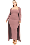 Woman wearing a mauve ribbed dress with a matching cardigan on a white background