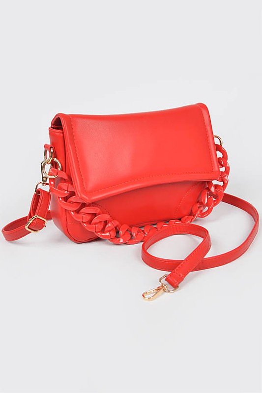 Bright red crossbody bag with a flap closure, chunky chain detail, and adjustable strap, displayed against a plain background.