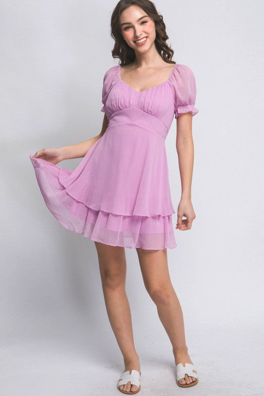 Woman wearing a pink dress on a white background