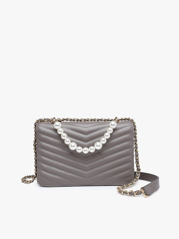 Gray quilted handbag with pearl embellishments on a white background