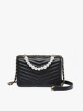 Black quilted handbag with pearl chain on a white background
