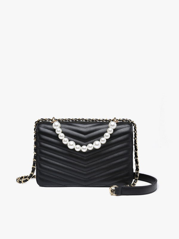 Black quilted handbag with pearl chain on a white background