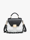Black and white handbag with gold accents on a light gray background