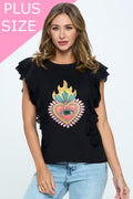 A plus-size woman wears a black t-shirt with layered ruffle sleeves and a colorful heart graphic featuring a flame and eye design at the center. She pairs it with light-wash jeans, standing against a neutral background with a “PLUS SIZE” label displayed in the top corner.