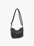 Black handbag with chain detail on a light gray background