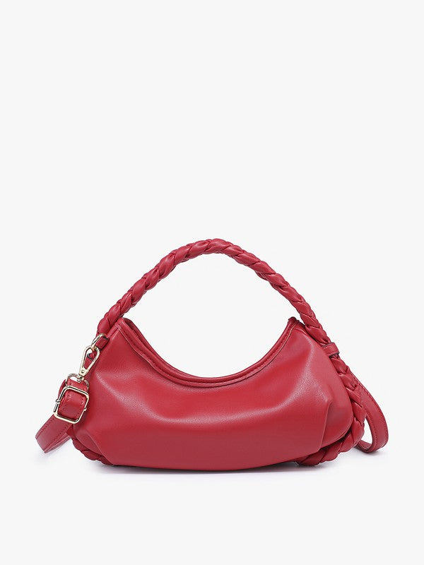 Red handbag with braided handle on a white background