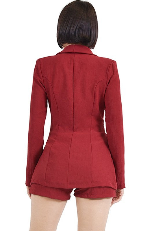 Red blazer and shorts set on a white background