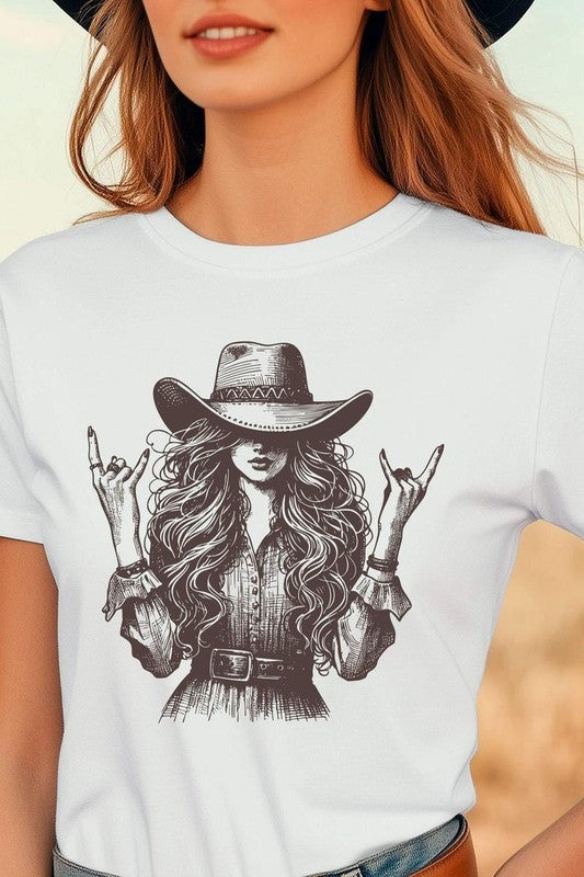 White t-shirt with a graphic of a woman wearing a cowboy hat and making a rock sign, worn by a person.