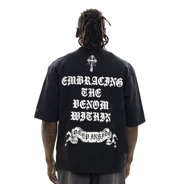 Person wearing a black t-shirt with white text and design on the back, on a white background