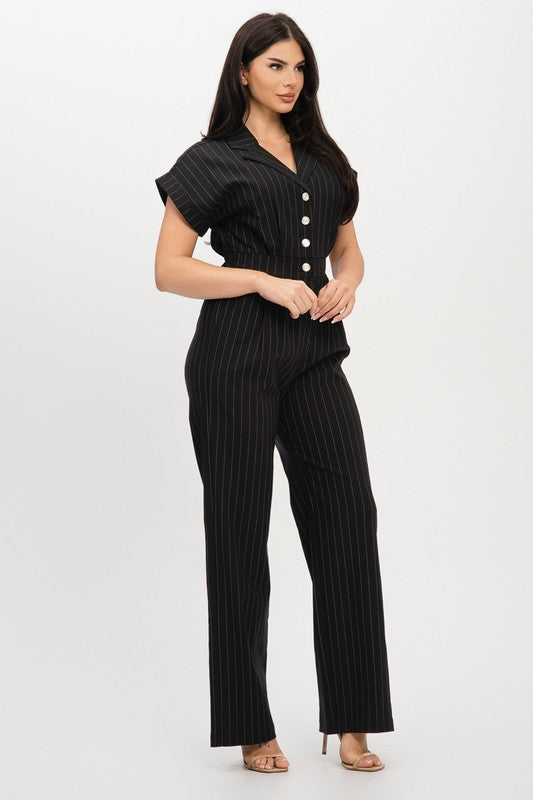 Woman wearing a black pinstripe outfit on a white background