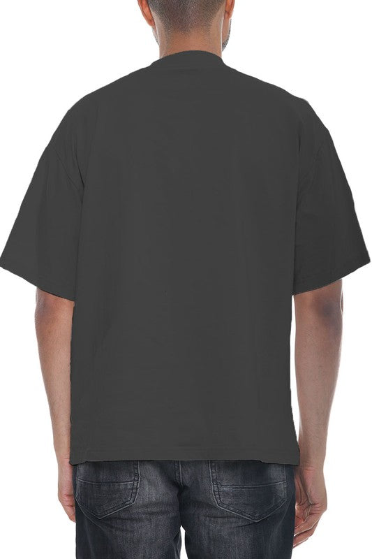 Black t-shirt worn by a person on a white background