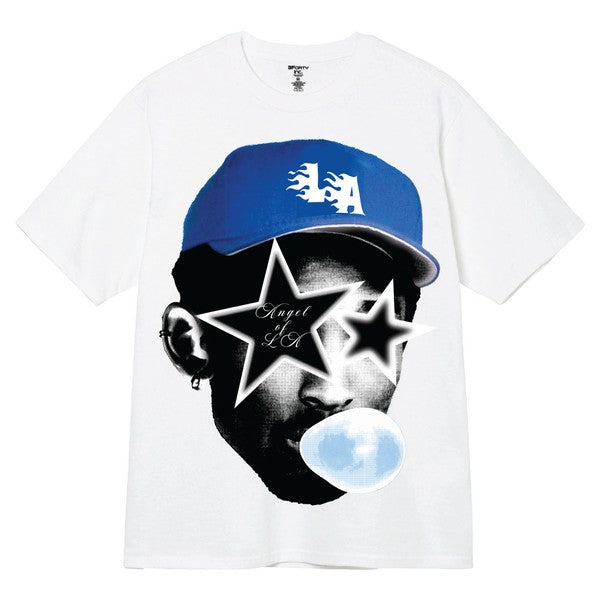 White t-shirt with graphic design of a person wearing a blue cap and stars, on a white background.