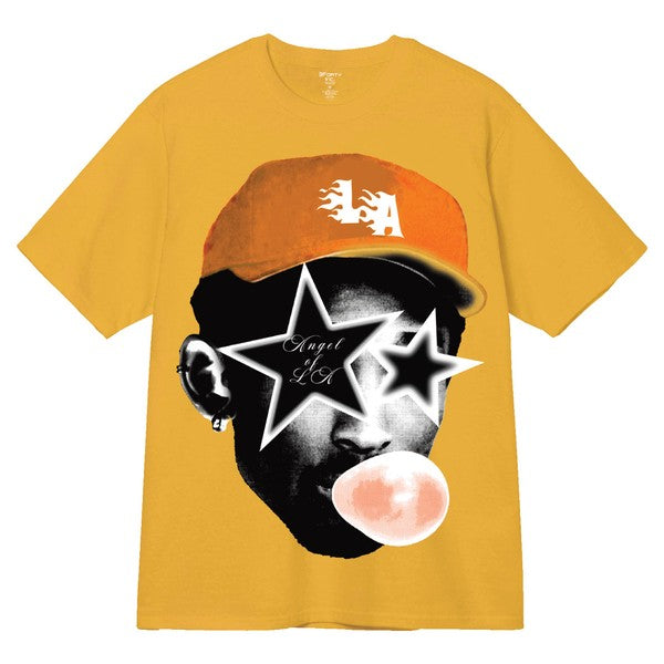 Gold t-shirt with graphic design of a person wearing a blue cap and stars, on a white background.