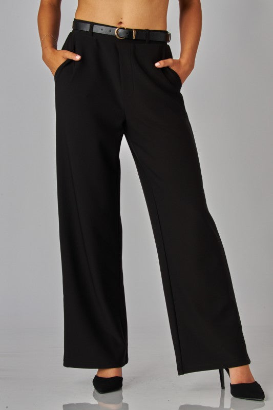 Black pants with belt and heels.