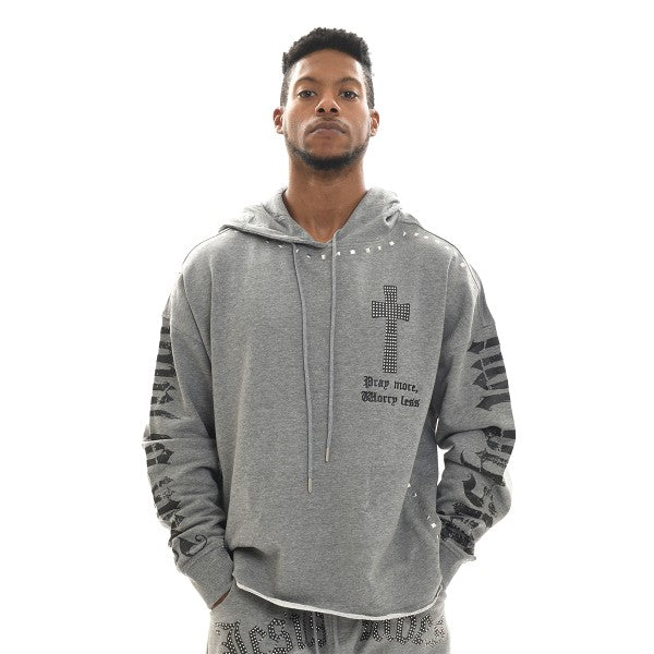 Man wearing a gray hoodie with a cross design and text on a white background