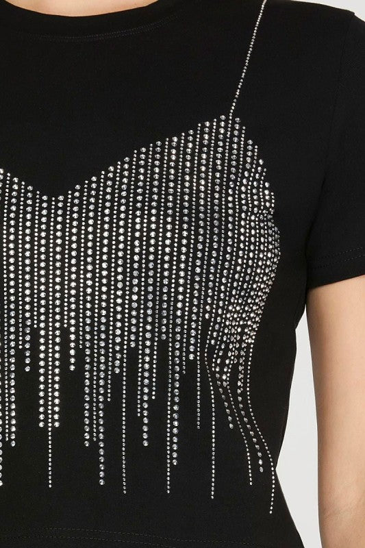 Black top with sparkling rhinestone details on a plain background