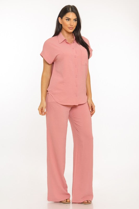 Woman wearing a pink outfit on a white background