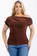 A woman modeling a brown off-the-shoulder short-sleeve top with blue jeans against a plain white background.