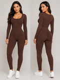 A woman modeling a fitted long-sleeve one-piece jumpsuit in solid dark brown, shown from both the front and back against a light gray studio background. She is wearing white sneakers.