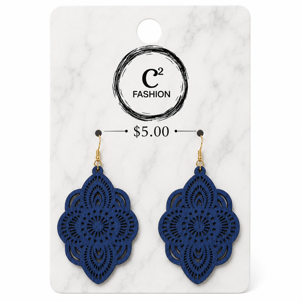 A pair of navy blue laser-cut dangle earrings with gold hooks, displayed on a white marble-patterned retail card with the C2 FASHION logo and a $5.00 price label.