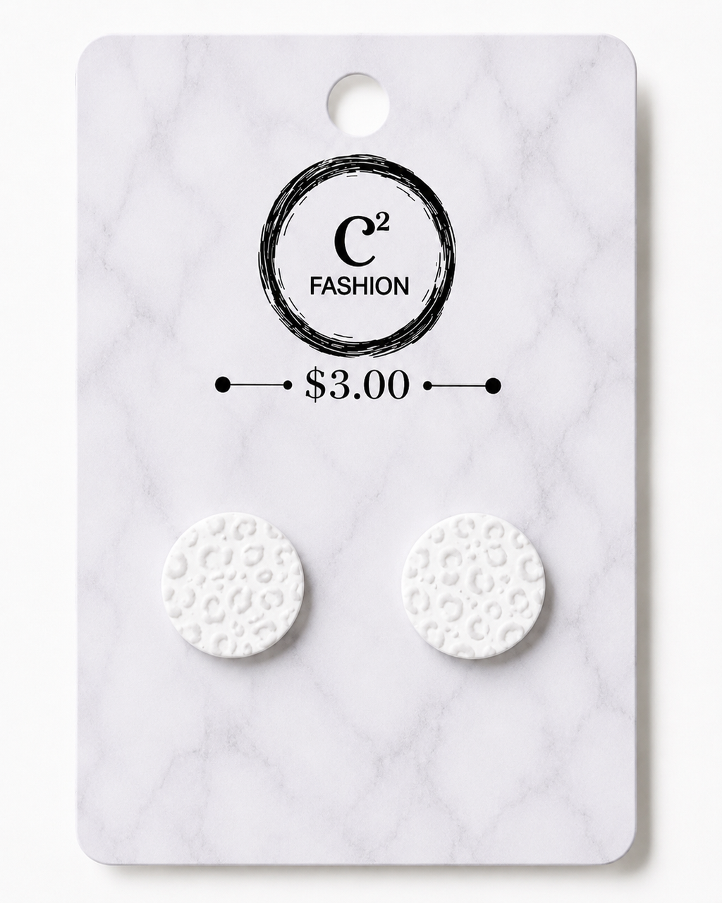 A pair of round white stud earrings with a textured leopard print pattern, mounted on a white marble-patterned display card featuring the brand name 'C2 FASHION' and a price of '$3.00'.