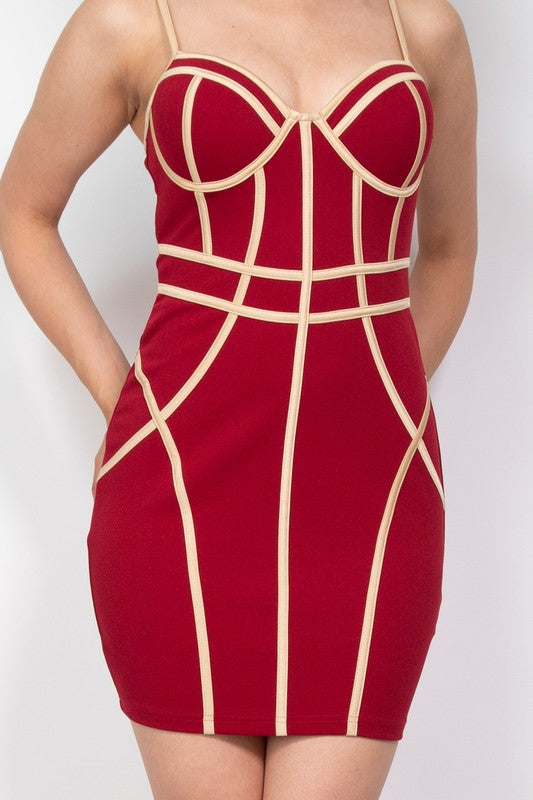 Red dress with beige geometric patterns on a white background