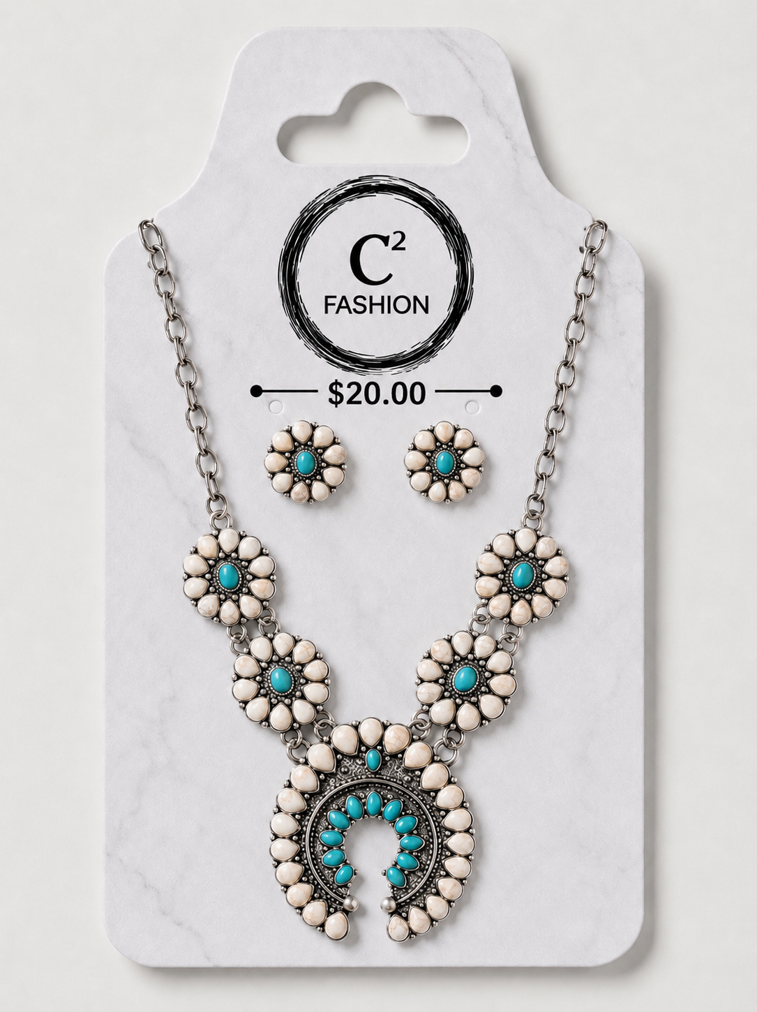 A C2 Fashion jewelry set featuring a silver-tone necklace and matching stud earrings with white stone flower motifs and turquoise blue accents, displayed on a white marble-patterned retail card.