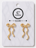 A pair of gold bow-shaped earrings displayed on a white marble-style retail card with the brand name C² FASHION and a price of $3.00 printed on it.