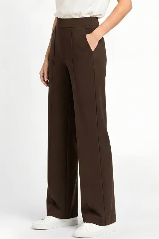 Brown wide-leg pants worn by a person on a white background