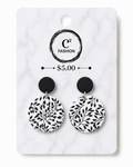 Black and white clay hanging earrings with black details 