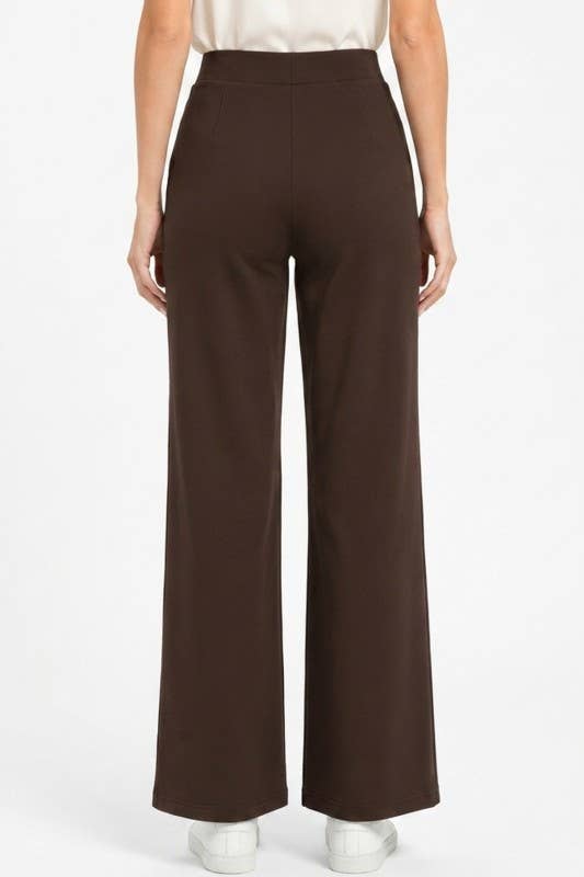 Brown wide-leg pants worn by a person on a white background