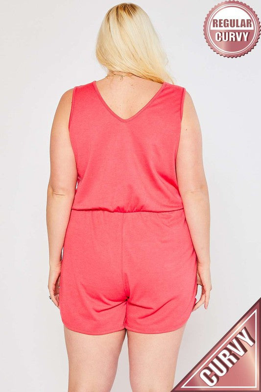 Person wearing a pink romper with 'Regular Curvy' label on a white background