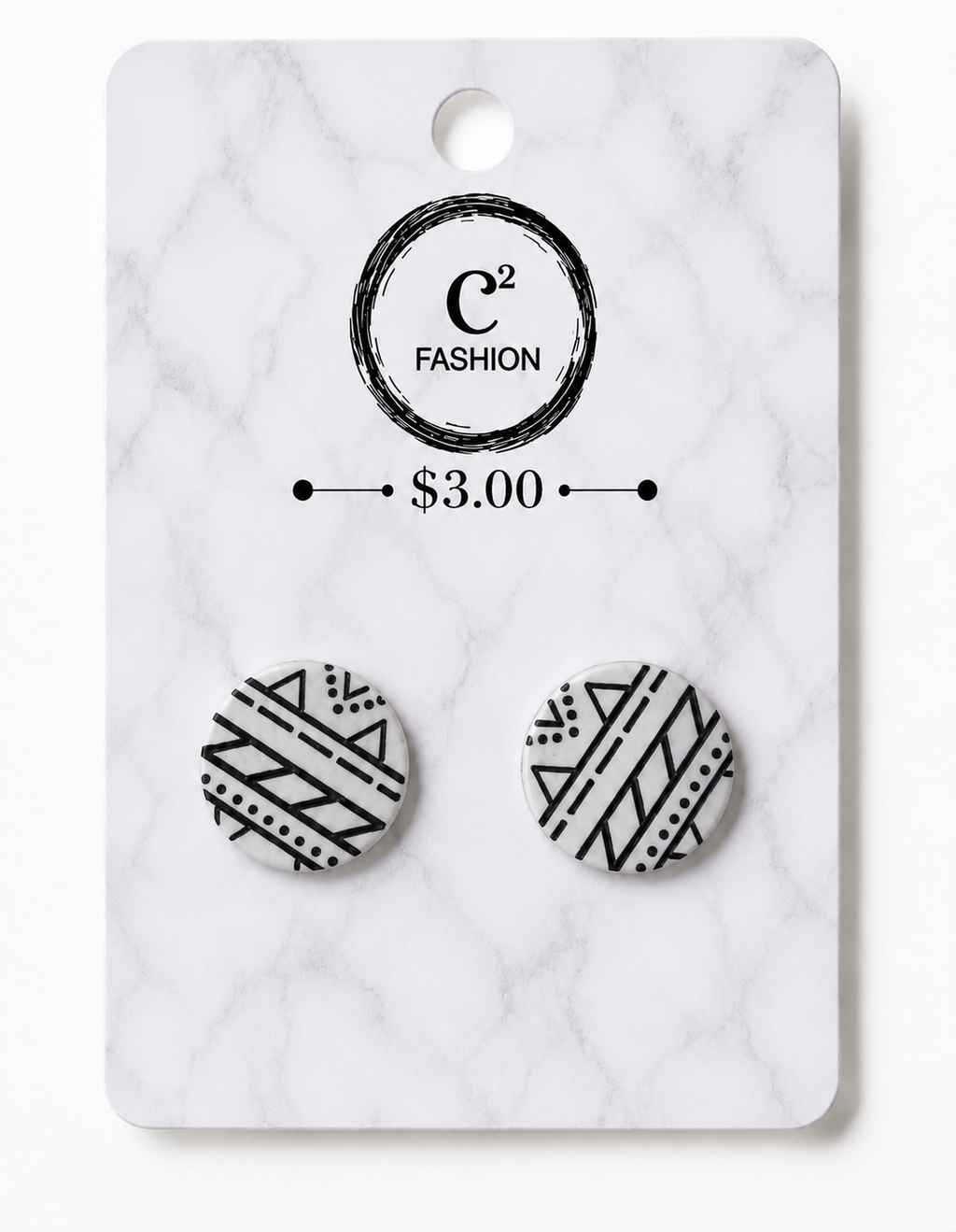 A pair of round stud earrings with black geometric tribal patterns on a white background, mounted on a white marble-patterned display card with the brand name C2 FASHION and a $3.00 price printed on it.