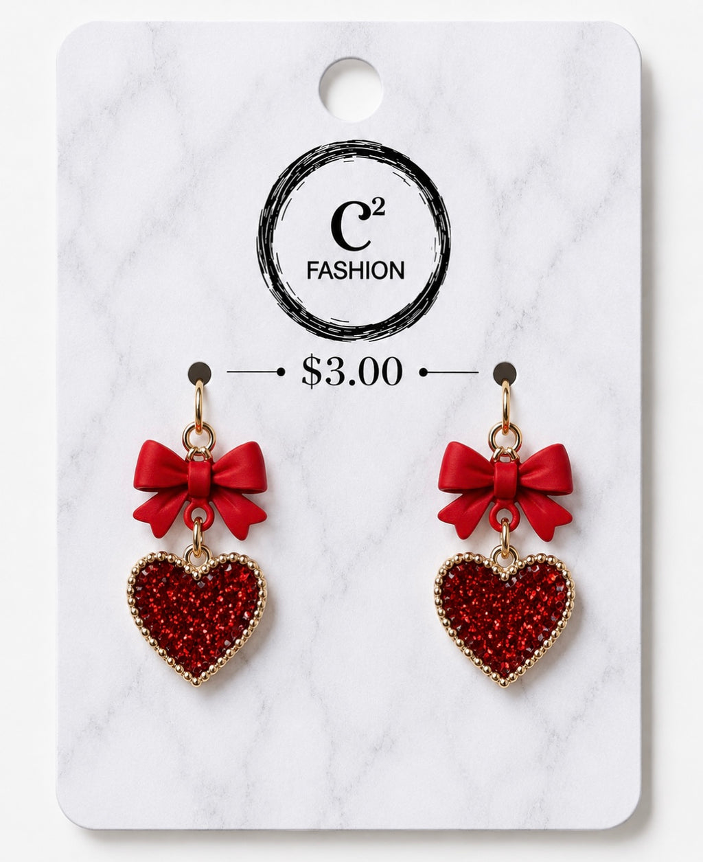 A pair of red heart-shaped dangling earrings with red bow charms, displayed on a white marble-patterned retail card. The card shows the brand name 'C2 FASHION' and a price of '$3.