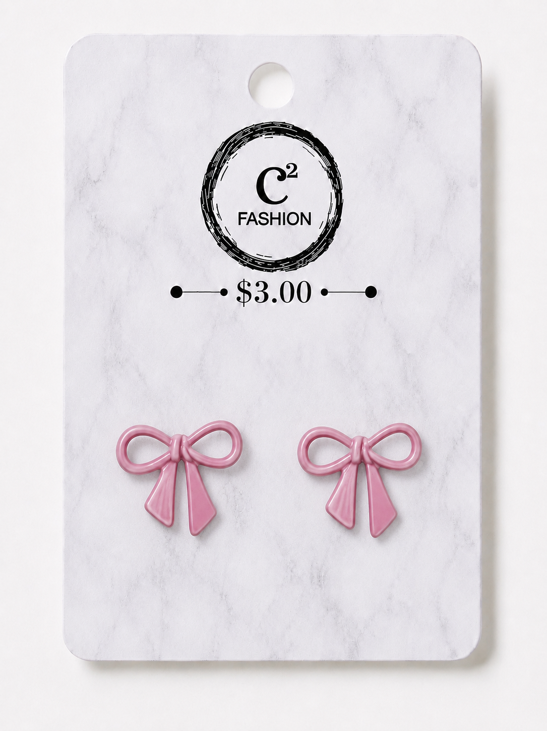 A pair of pink bow stud earrings displayed on a white marble backing card with a black circular logo that reads 'C2 FASHION' and a price of '$3.00'.
